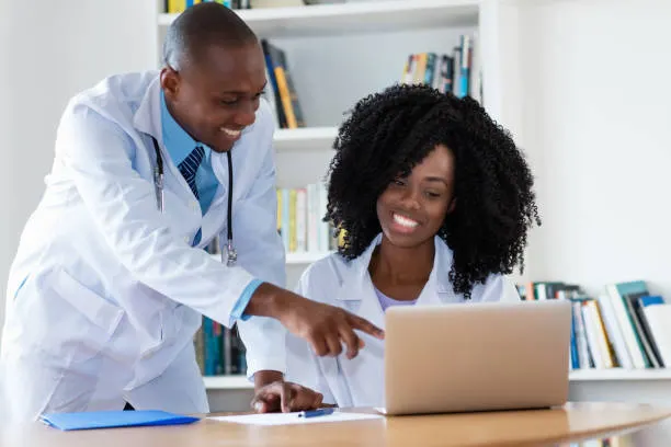 Two clinicians reviewing a patient case together